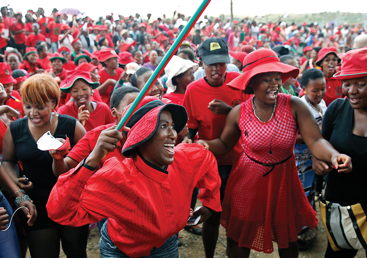 Supporters of the Democratic Congress party chant slogans in the capital Maseru