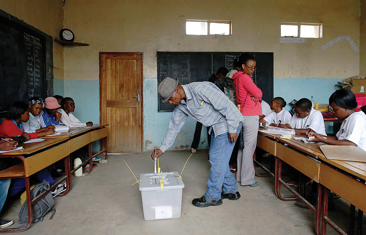 Man casts his vote during Lesotho's national election in Qoaling village