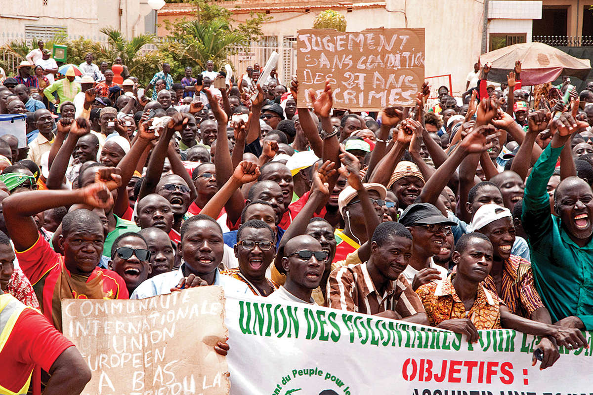 People gather at a rally in support of a law that prohibits the candidature of anyone who supported ousted president Blaise Compaore in the upcoming presidential elections, Ouagadougou
