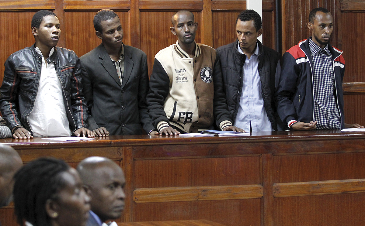 Suspects stands inside the dock at the Milimani Law Courts in Kenya's capital Nairobi