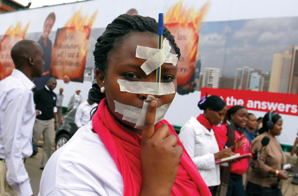 A Kenyan Journalist Protest In A Demonstration With Tape Over Her Mouth And A Pen On Her Forehead Along The Streets Of The Capital Nairobi